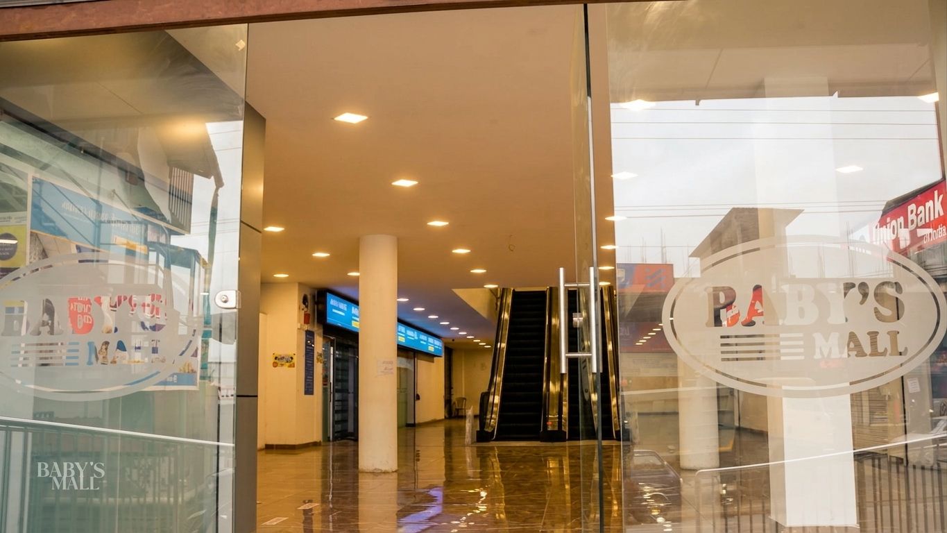 Main entrance of Baby's Mall with etched glass doors